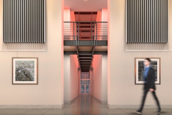 rendering of person walking through gallery lobby entrance